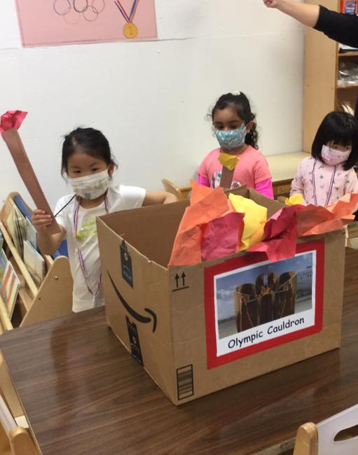 Summer Camp at The International Preschools: Olympics 2021 2 Lighting the Olympic torch from the Olympic cauldron at 76th Street!