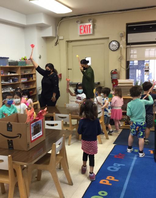 Summer Camp at The International Preschools: Olympics 2021 4 Marching with our Olympic torches at 76th Street!