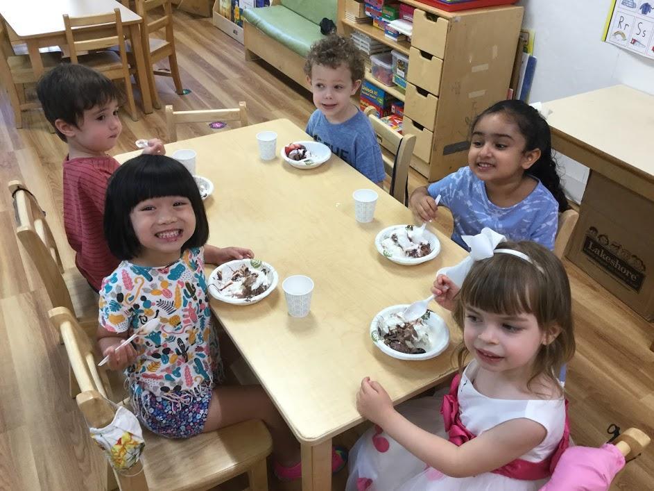 Green Room kids enjoying ice cream sundaes at snack time on the last day of school!