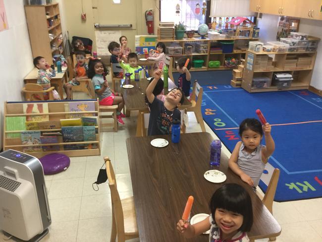 Socializing at snack time with the Little Dolphins at 76th Street!