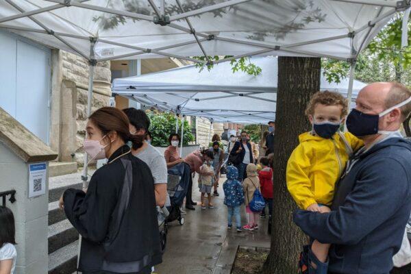 Families at the IPS West 76th Street location prepare for arrival on the first day of school. The (very) rainy weather didn't stop anyone from having a great time!