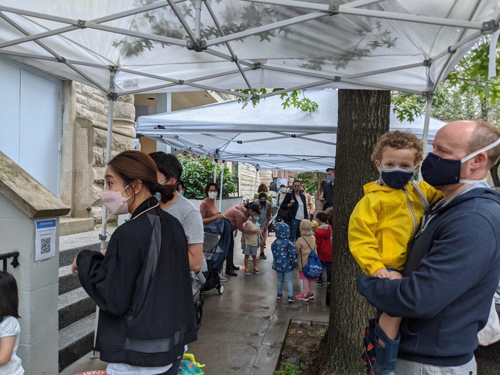 Families at the IPS West 76th Street location prepare for arrival on the first day of school. The (very) rainy weather didn't stop anyone from having a great time!